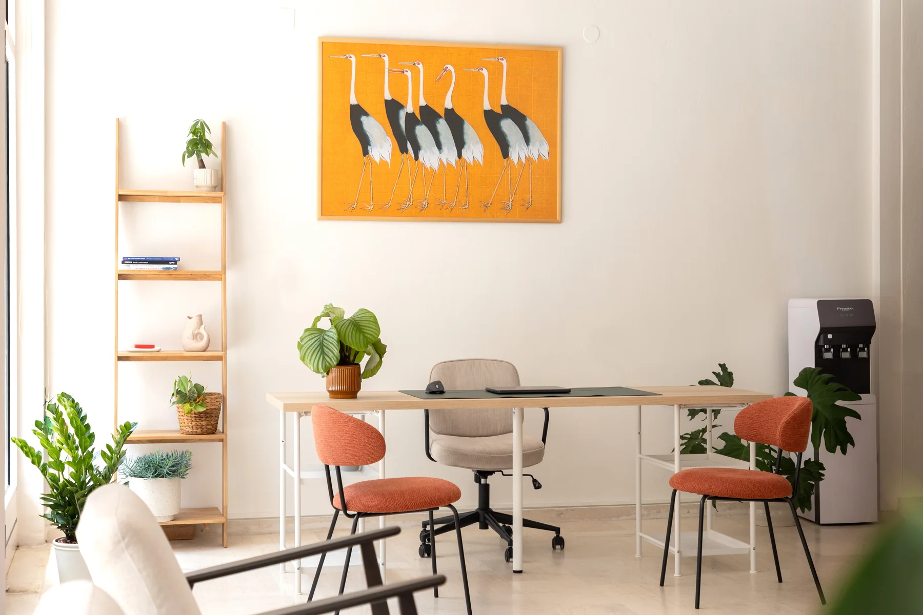 Meeting table and colourful chairs inside the YOLO Preveza base
