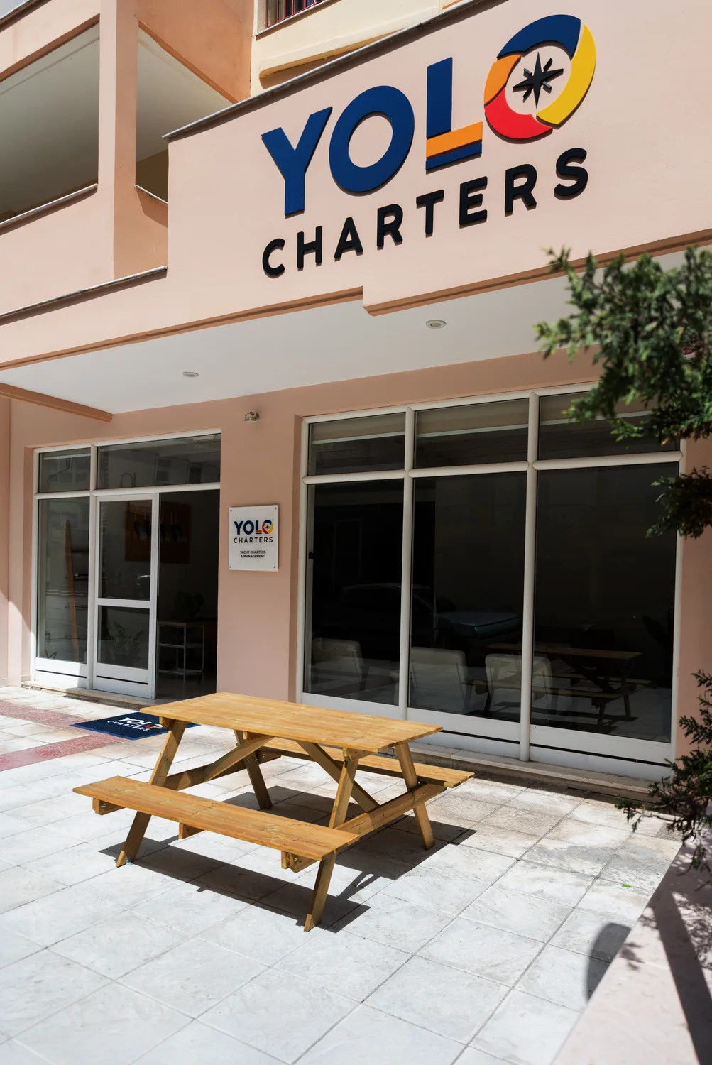 YOLO Charters sign above the entrance to the Preveza base