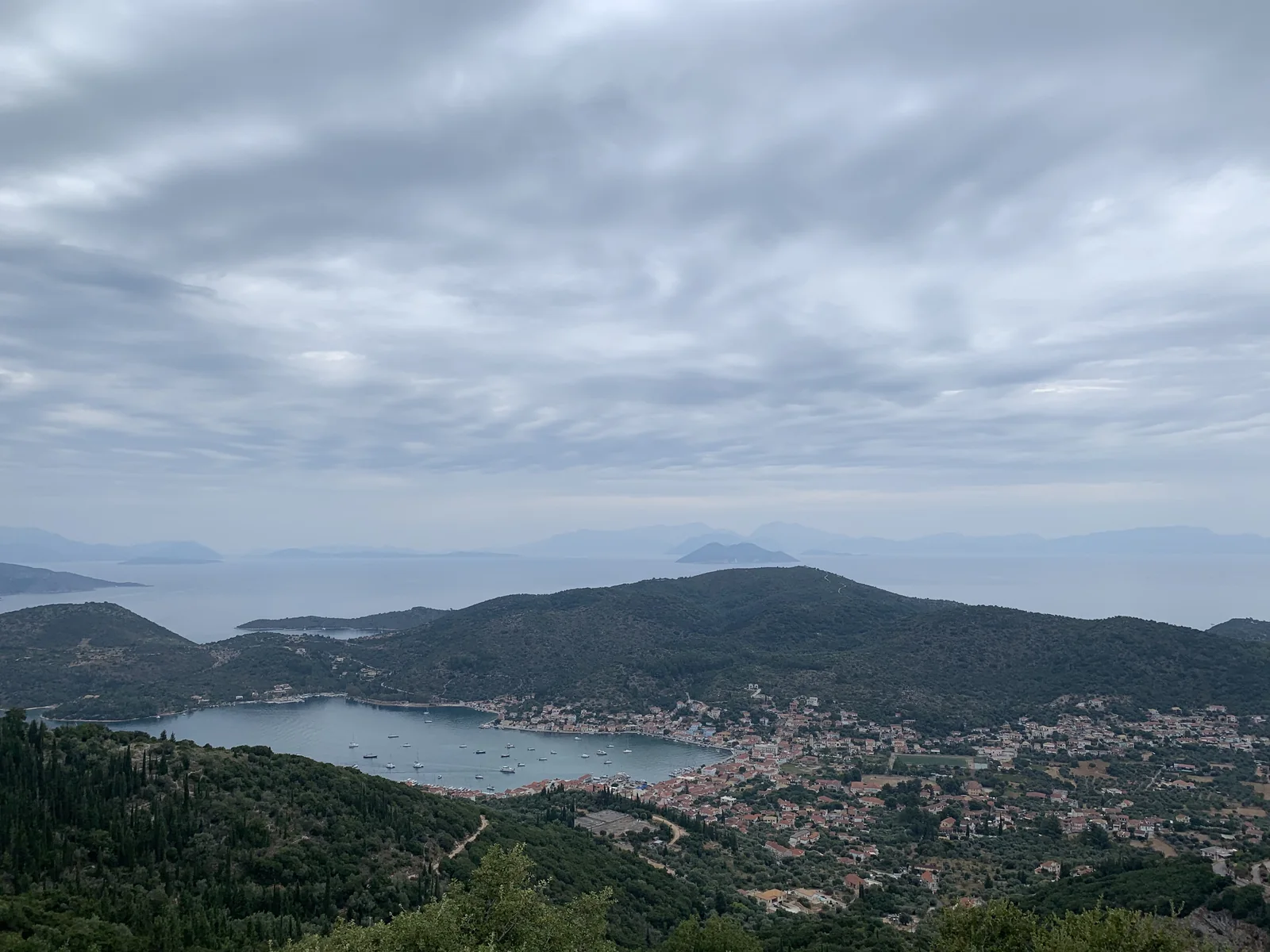 View from Palaiochora over Vathy town and its bay on Ithaca under a cloudy sky