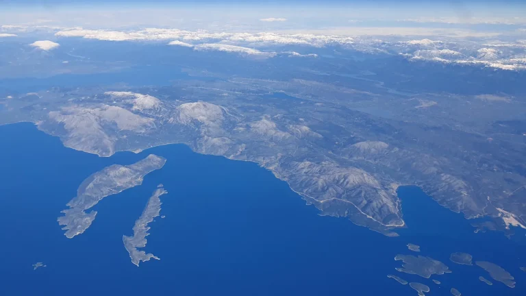 Kalamos and Kastos seen from the air beside the mountainous Greek mainland
