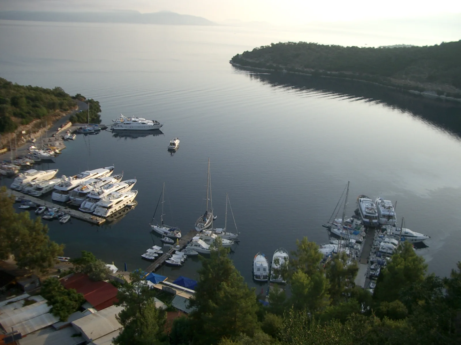Boats in Spilia bay seen from the hillside village of Spartochori on Meganisi